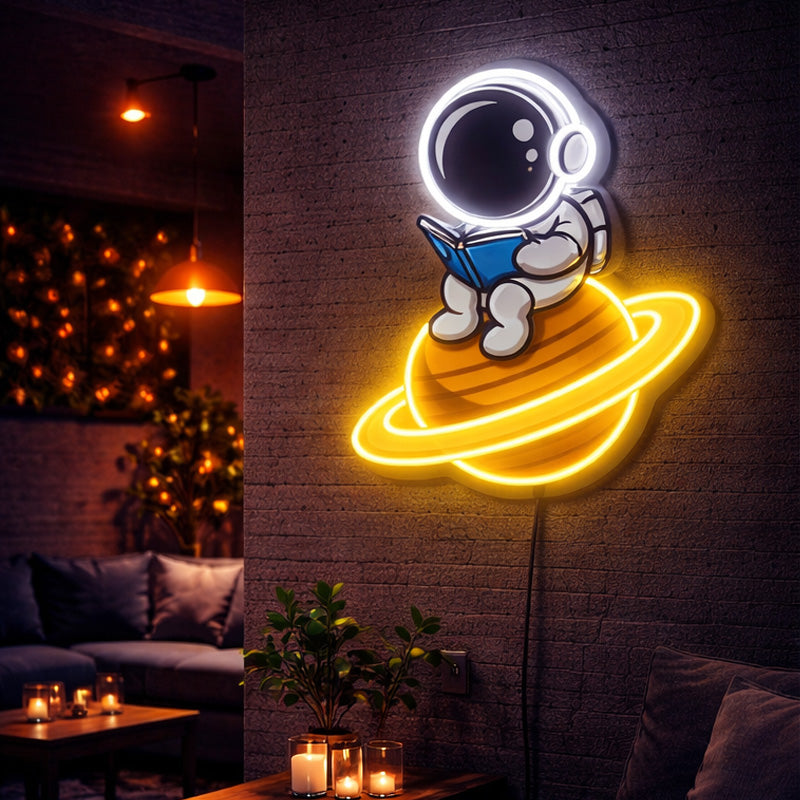 Astronaut Reading on Saturn Neon Sign – Space-Themed LED Wall Light Decor