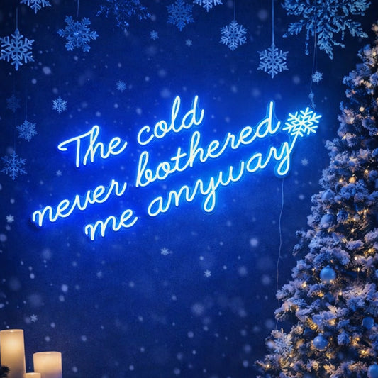 “The Cold Never Bothered Me Anyways” Neon Sign – Blue Script LED Neon Quote with Snowflake Accent