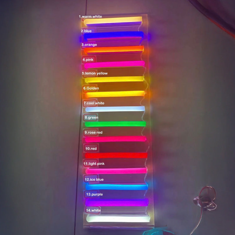 Neon sign LED color samples including warm white, blue, orange, pink, yellow, green, red, purple, and white displayed on an acrylic panel